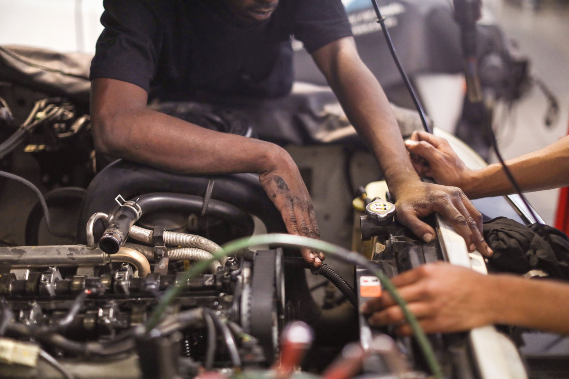Diesel technicians working on an engine.